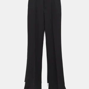 Pantalones slim con talón al descubierto